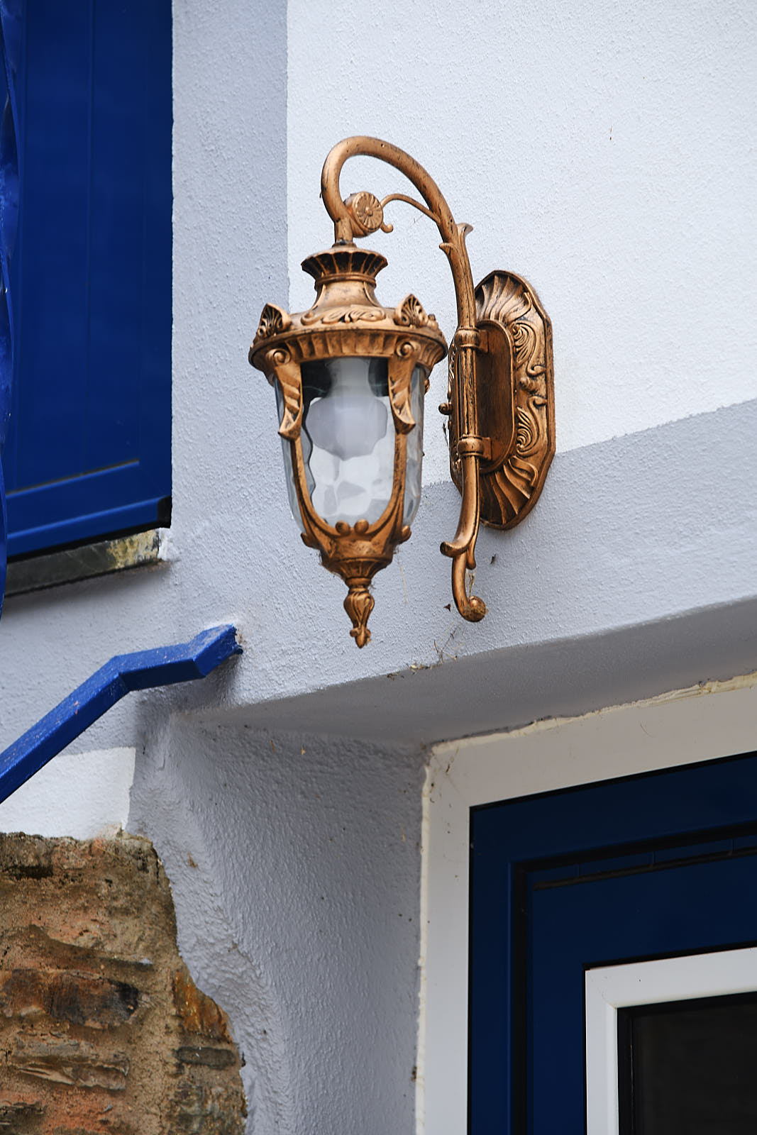 Close-up of the traditional bronze exterior wall lantern